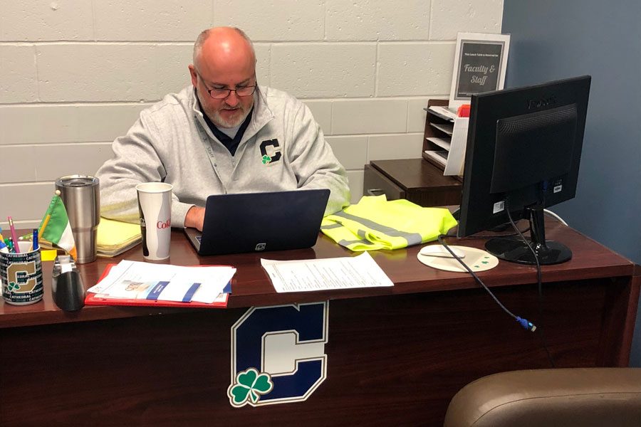 During E period on Nov. 7, social studies teacher Mr. Anthony Ernst works in the student services suite. 