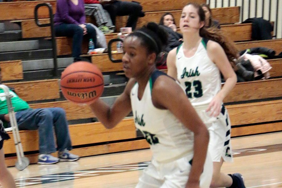 During the varsity game last season against Lafayette Central Catholic, Justis Gordon brings the ball up the court. 