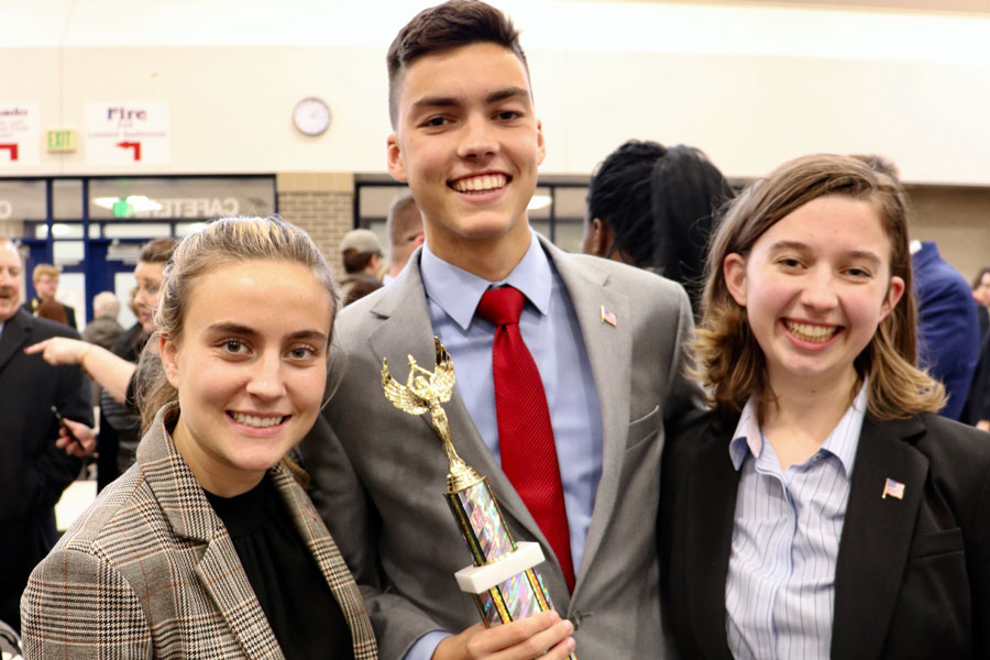 Just after the We the People team was announced as the Regional winner on Nov. 9 at Hamilton Southeastern High School, seniors Carson Kwiatkowski, Jackson Hern and Kat Griffith show off the trophy. 