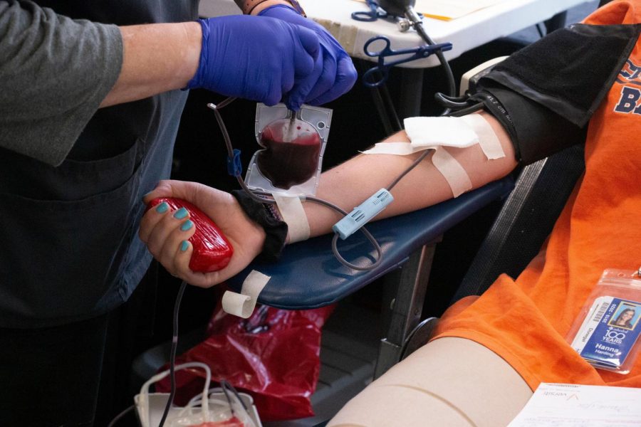 A student donates blood during a previous blood drive on campus.  