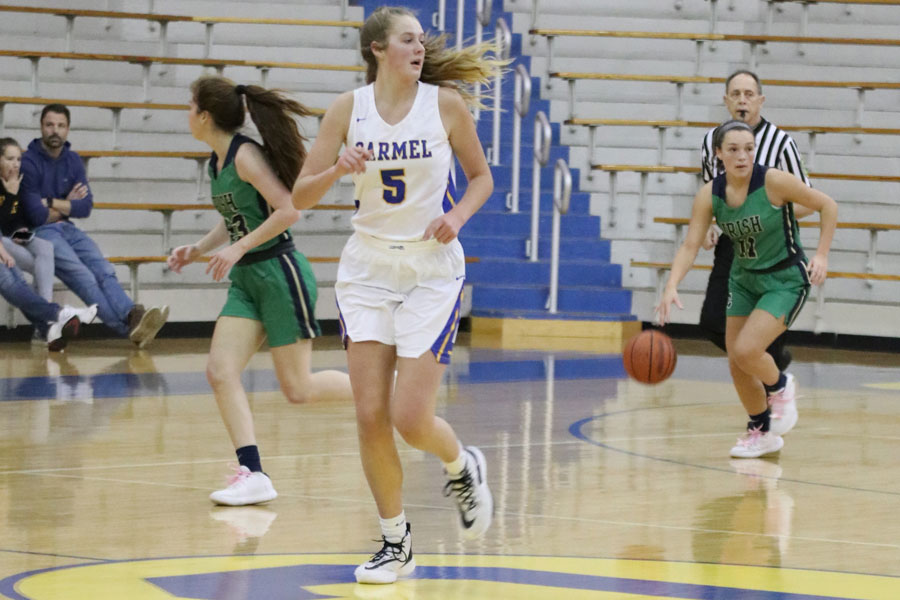 Senior Cassie Piper brings the ball up the court during the Jan. 28 varsity game at Carmel. The Irish open Sectional play on Jan. 5. 