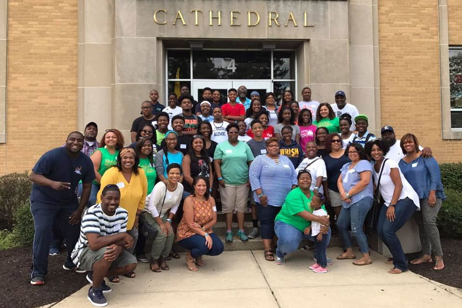 Members of the Black Alumni Council and their guests gather at the main entrance. 