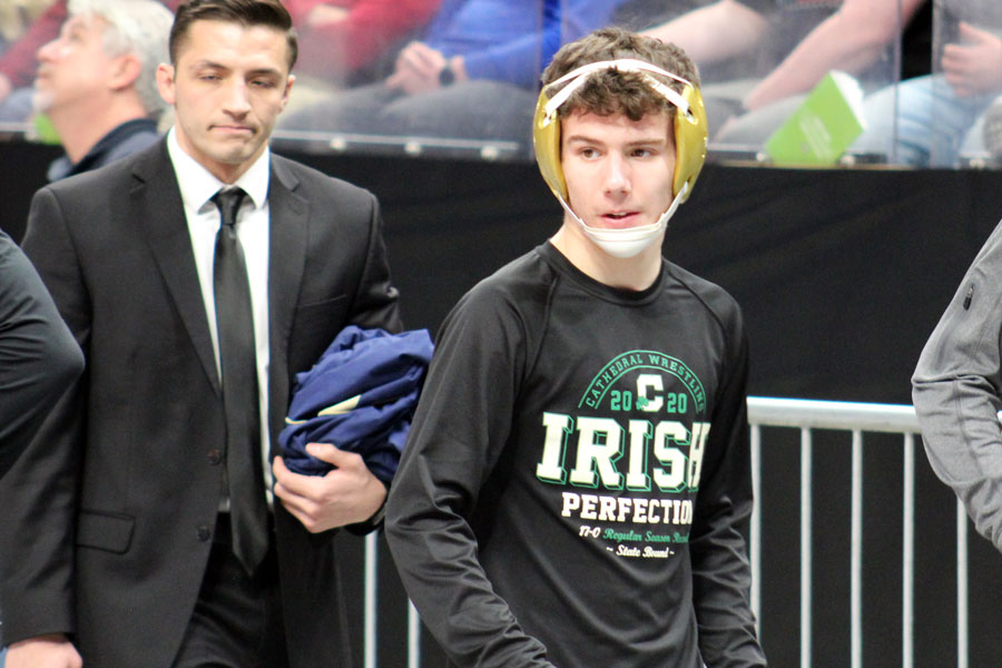 Sophomore Zeke Seltzer prepares to take to the mat at the wrestling State Finals at Bankers Life Fieldhouse. 