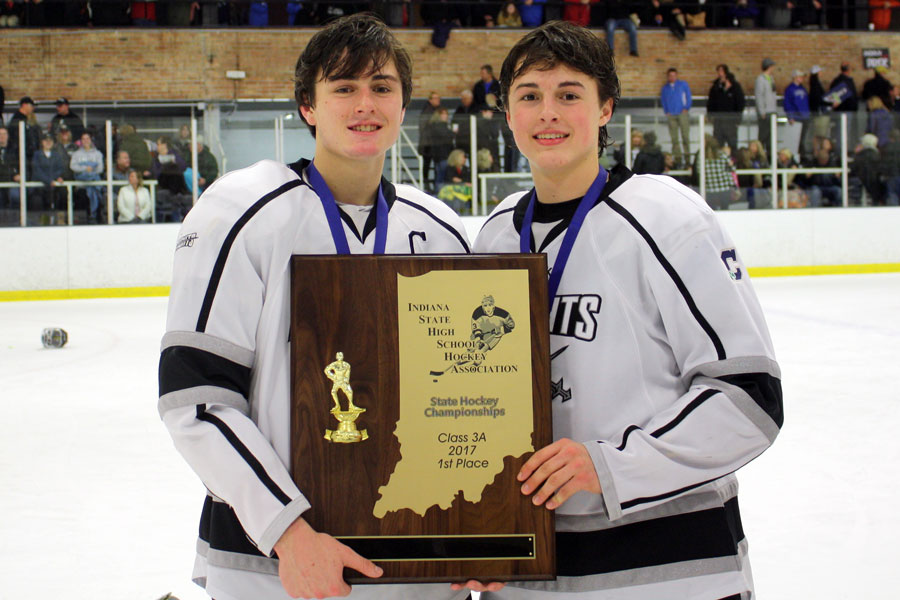 The Bedich brothers, David on the left and Sam on the right, take the ice with the 2017 State championship trophy. 