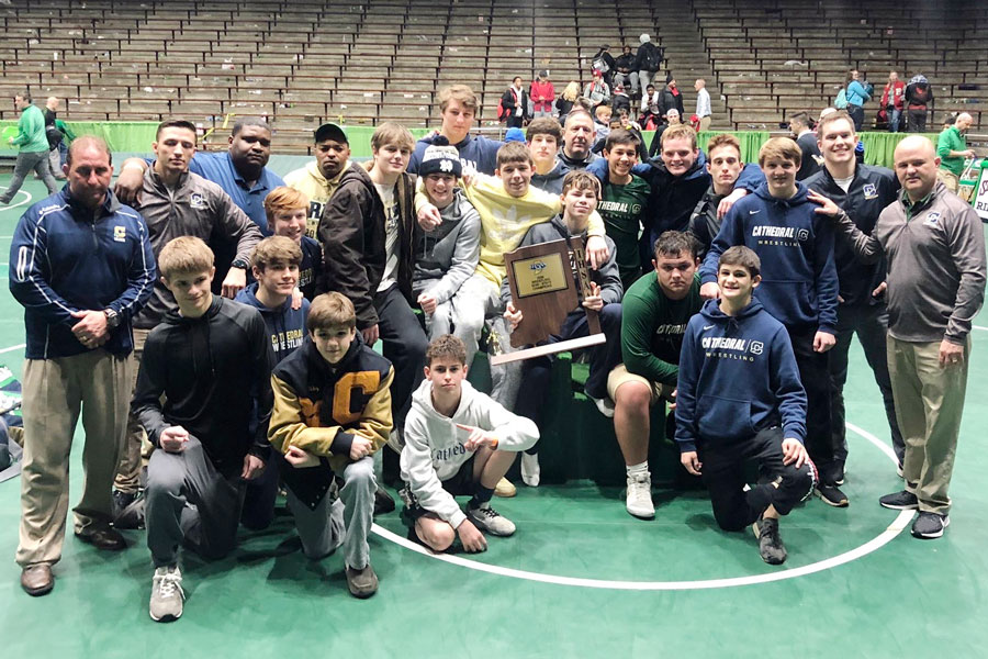 The wrestling team shows off its Semistate championship trophy on Feb. 15 at New Castle. 