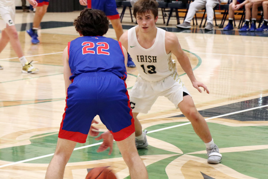 Senior Ryan Trusler gets into defensive position during the varsity's regular season game against Roncalli.