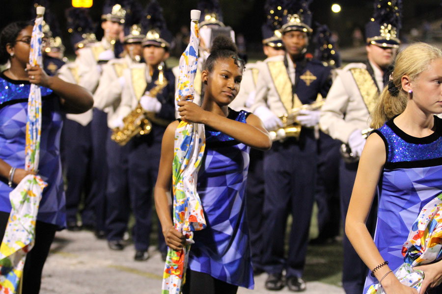 The Color Guard participates in the halftime show during the football Homecoming game against Jeffersonville. 