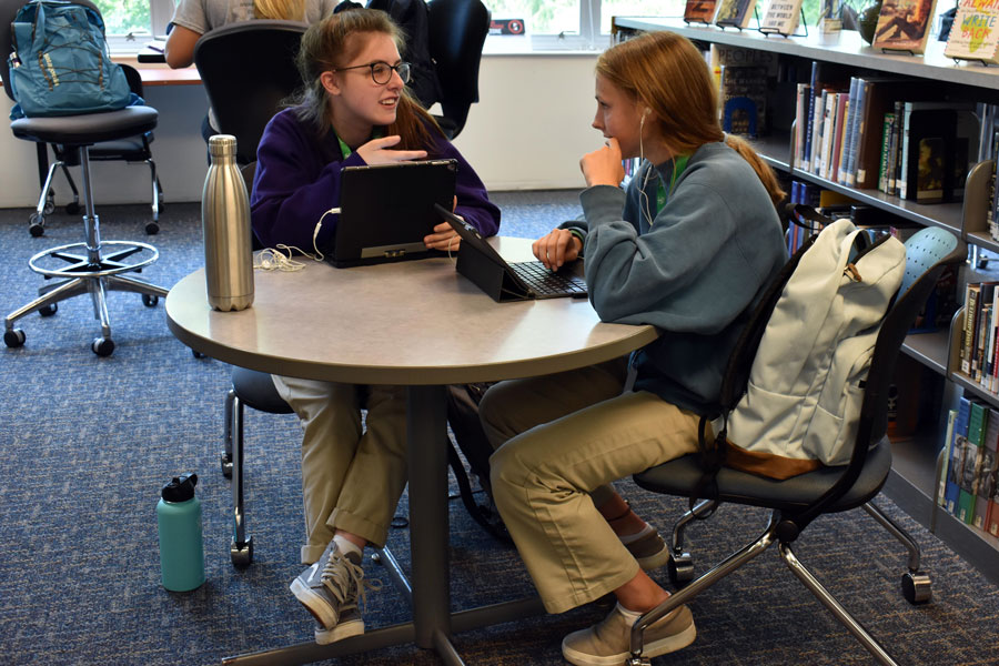 Seniors Meredith Duffy and Audrey McKinney work in the library earlier this school year. For them and their fellow members of the Class of 2020, their last day of classes will be May 8. 