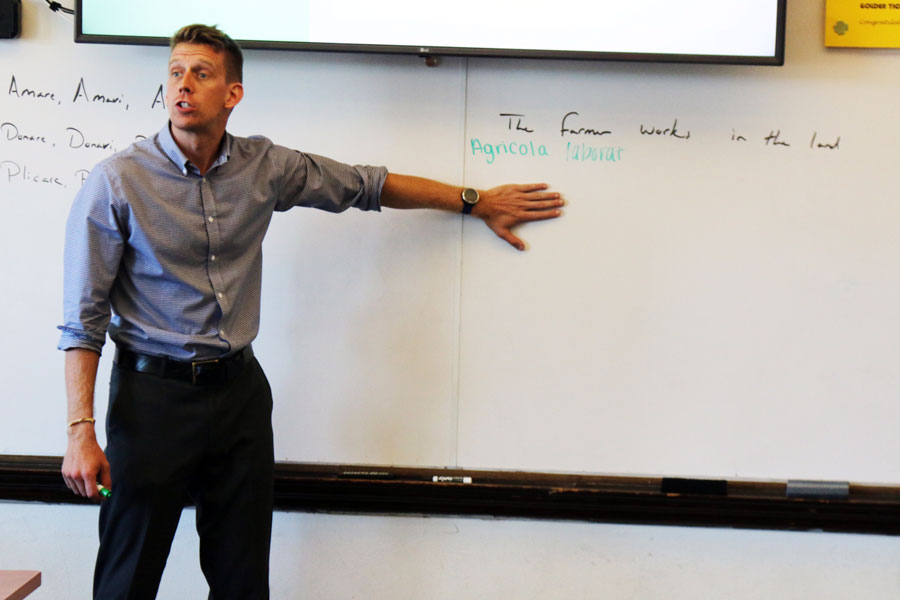 Mr. Brian Gross teaches a Latin class in his room on the first floor of Loretto Hall. 