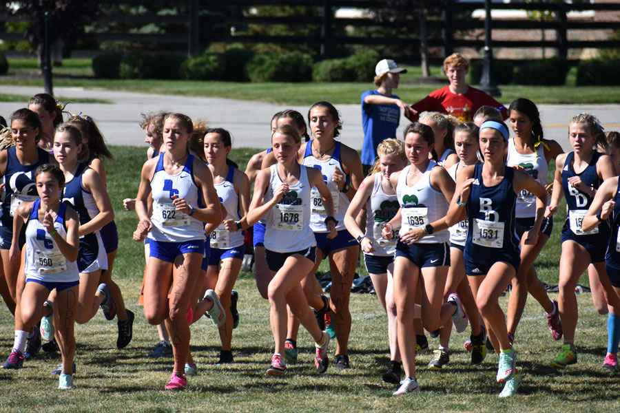 The women's cross-country team competes last fall. The squad will join the other fall sports when practice resumes in July. 