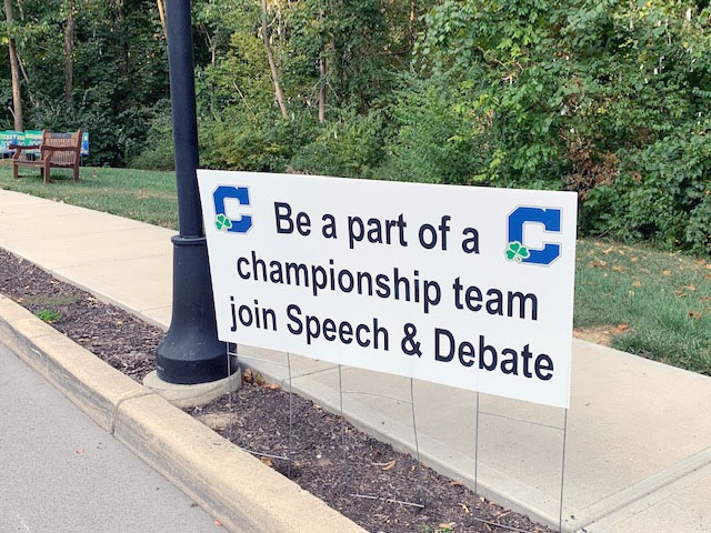 A sign on the Hill promotes the award-winning speech and debate team. 