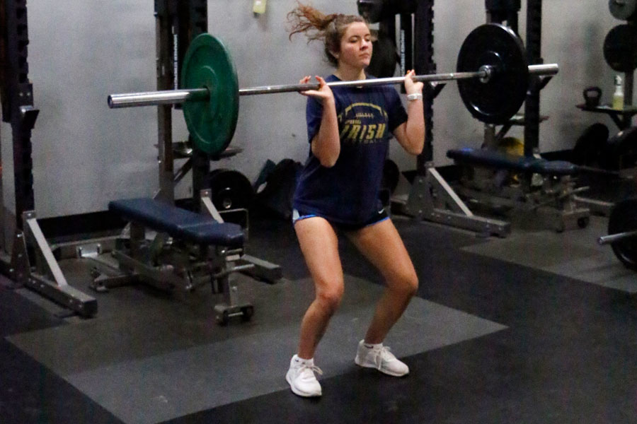 Students using the weight room on the second level of the Welch Activity Center adhere to Covid-19 guidelines. 