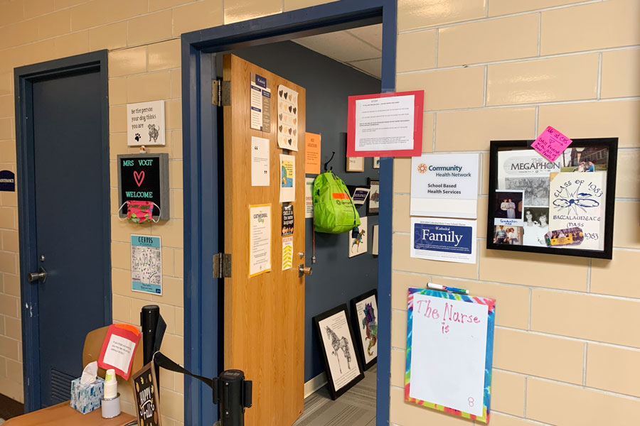 Tissues and hand sanitizer are among the items outside the nurse's office in Kelly Hall. 