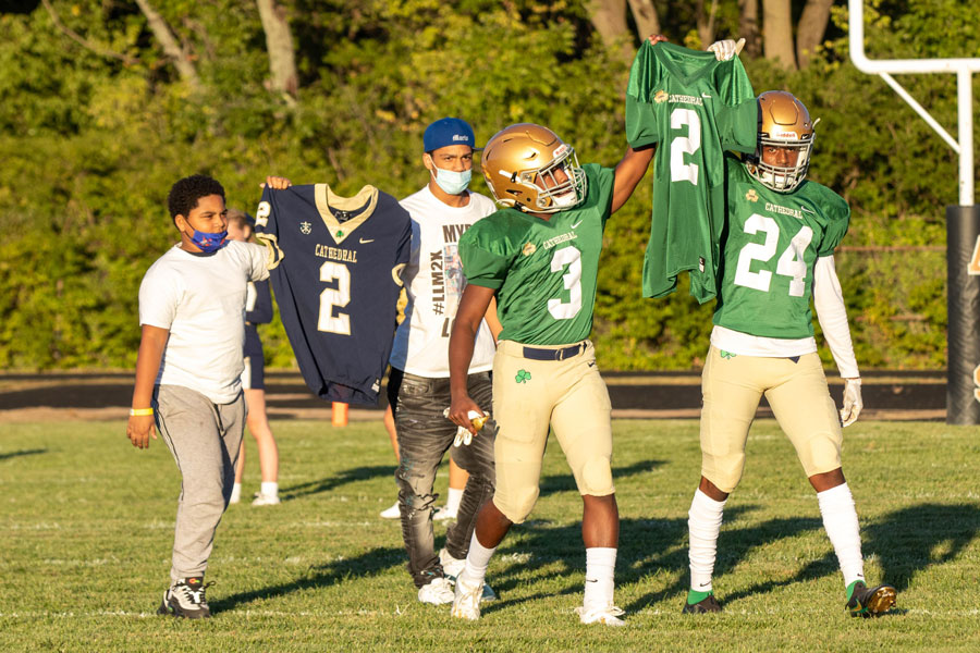 The Irish will have Mario McCullough in their hearts during the Class 5A State championship game on Nov. 28. Players carry McCullough's jersey onto the field during a game earlier this season. 