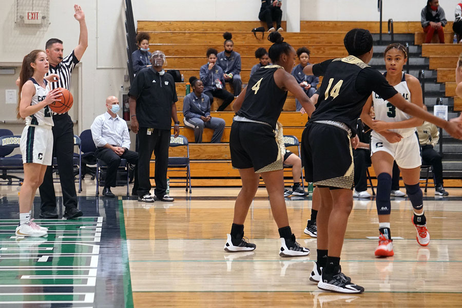 Senior Clara Lee looks to inbound the ball during the women’s varsity basketball home opener. 