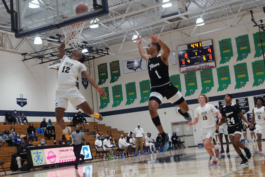 Junior Tayshawn Comer gets way, way off the floor for two points during the Dec. 19 game against Arsenal Tech. 