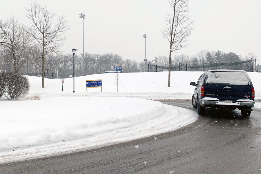 On the morning of Feb. 18, a driver navigates the traffic circle at the top of the Hill. 