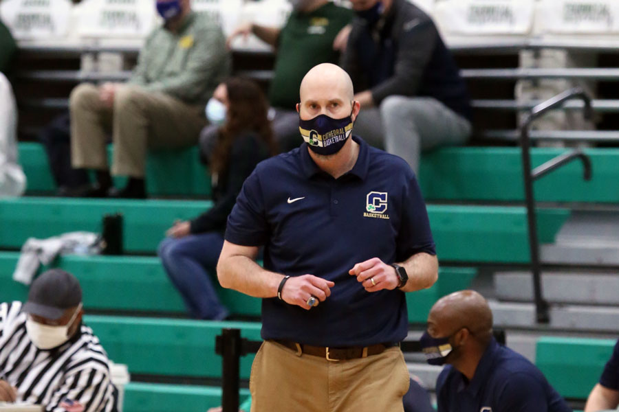 Head Coach Mr. Jason Delaney works the sideline during his team's City championship game earlier in the season. 