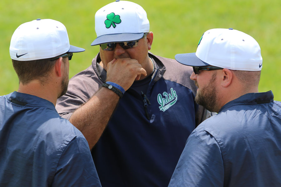 It's been almost two years since the varsity baseball team took the field. Head Coach Mr. Ed Freije '99 confers with two assistant coaches during the 2019 season at the Regional. 