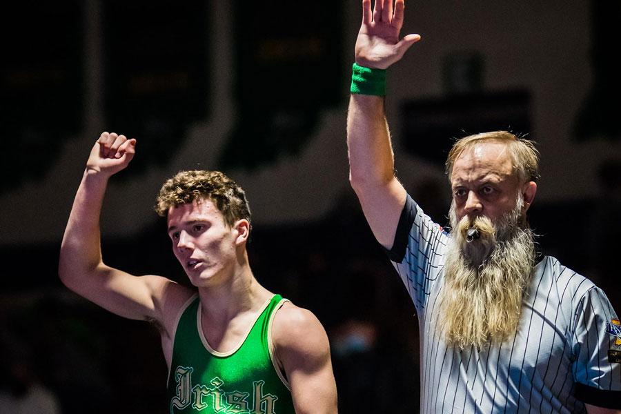 Junior Zeke Seltzer reacts after winning his match during the regular season meet against Perry Meridian. 