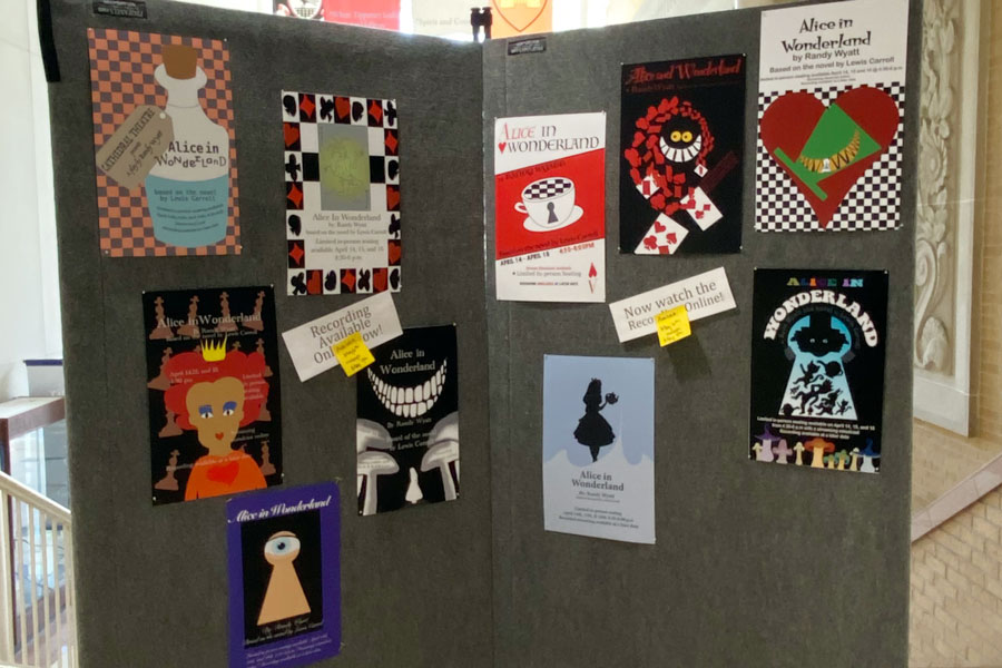 Posters in the atrium promote "Alice in Wonderland."