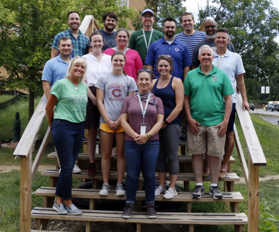 Most of the this year's new educators pose with Principal Mrs. Julie Barthel and Assistant Principal Mr. Mark Matthews during a break in their professional development meeting on Aug. 4. 