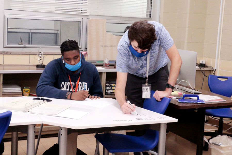 Mr. Michael Meyers assists a student in the Learning Commons. 