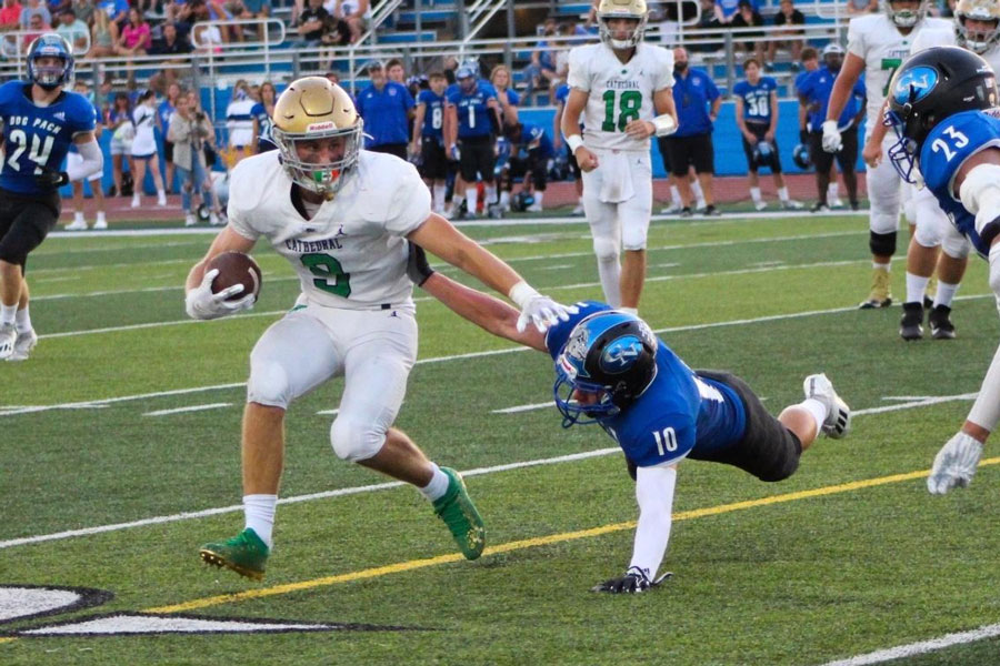 Senior running back Seth Mencer strong arms the Columbus North defense during his team's 37-13 win over the Bull Dogs. 