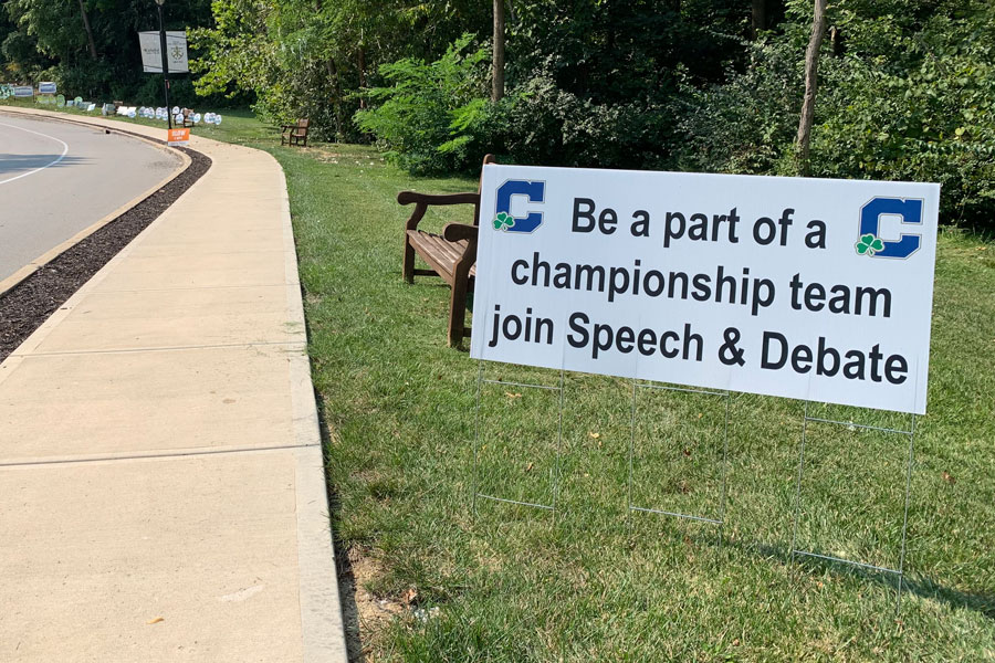 A sign on the Hill promotes the speech and debate team. 