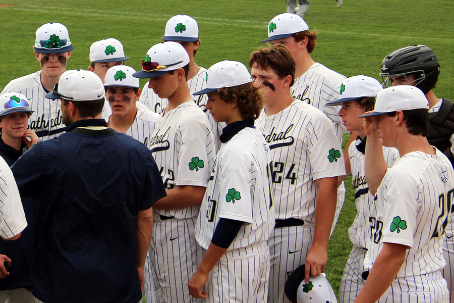 During last spring's regular season game against Franklin Central, Assistant Coach Mr. Jeremy Sinsabaugh addresses the Irish between innings. Dylan Haslett (#20) entered the game out of the bullpen, tallying three shutout innings en route to his first save of the season.