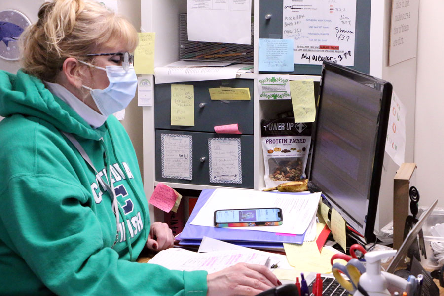 On the morning of Jan. 7, school nurse Mrs. Marianne Vogt '86 works in her office in Kelly Hall. 