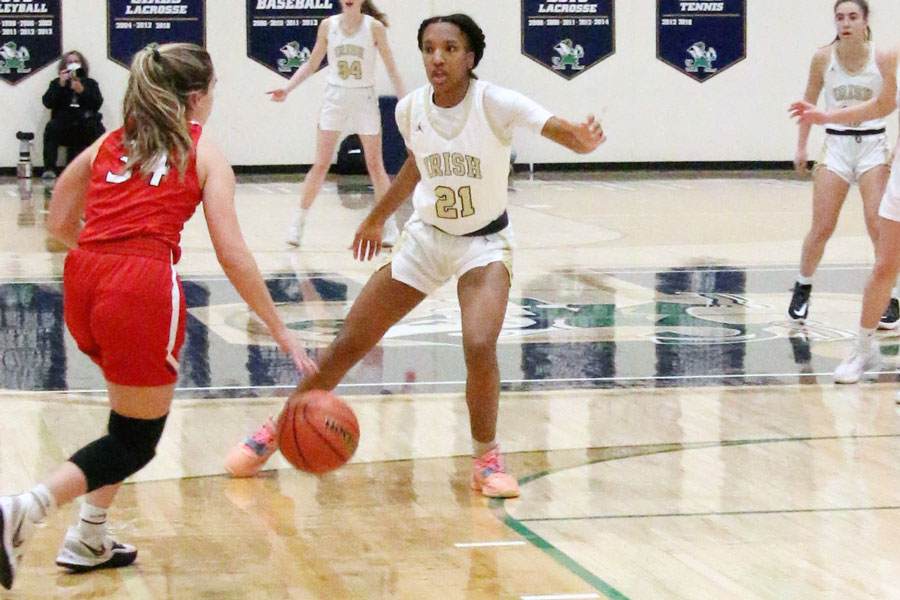 During the team's last regular season home game against New Palestine, junior Layla Gold plays sticky D. 