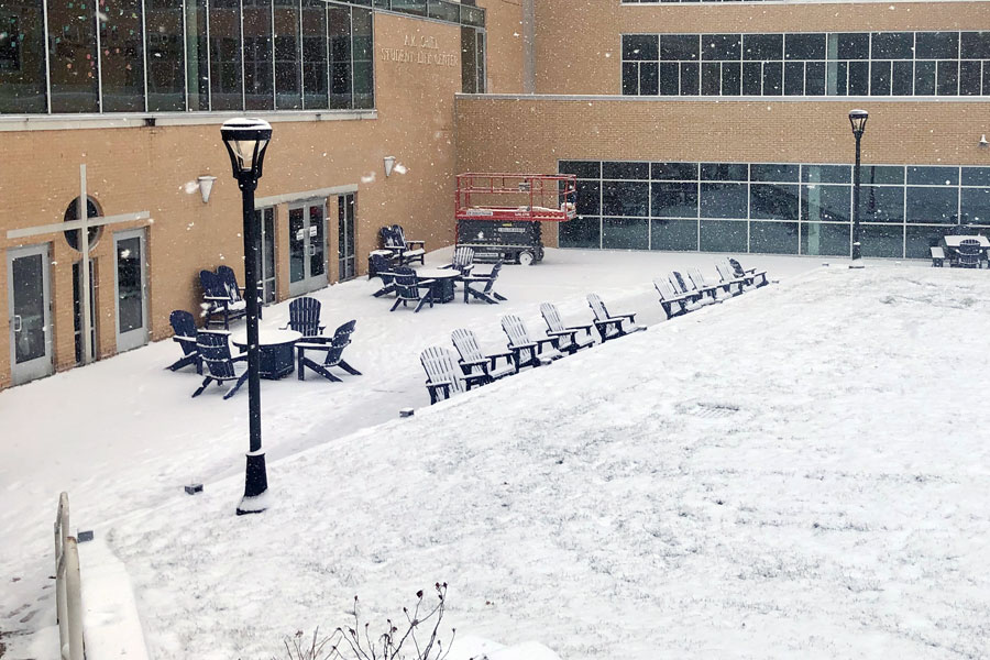 Snow begins to cover the courtyard outside the Shiel Student Life Center on Feb. 2. 