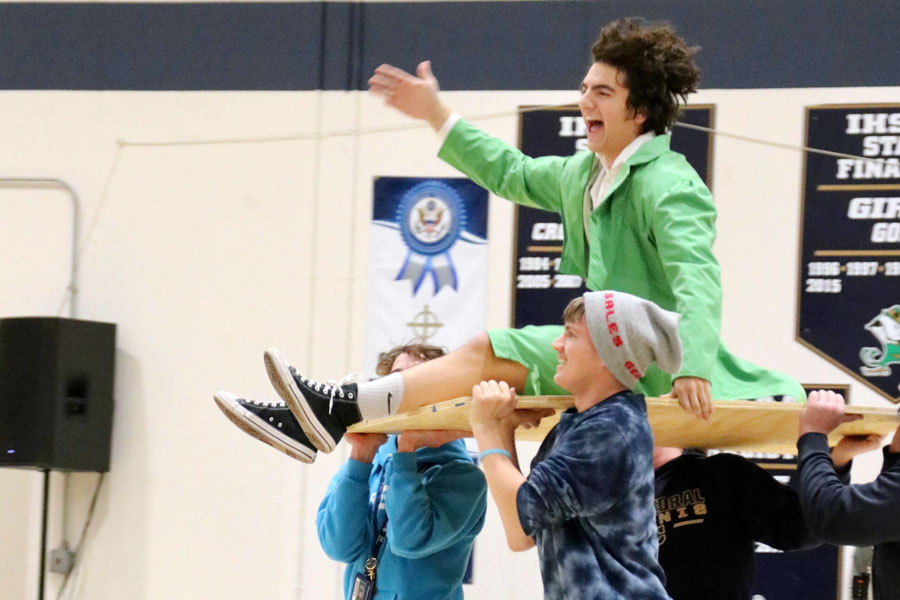 Junior Brody Snyder is carried onto the Welch Activity Center floor after being announced as one of two leprechauns for the next school year. He and senior Max McGinley will share duties. 