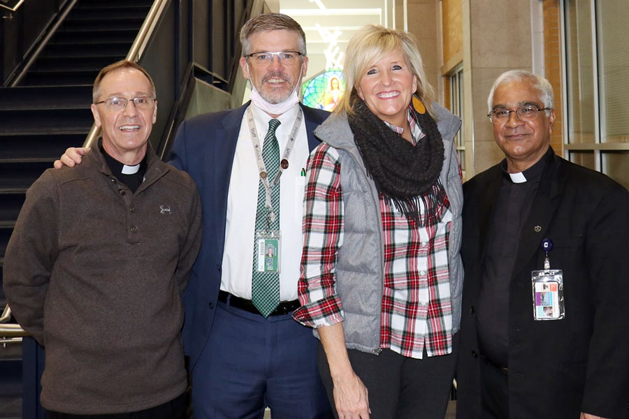 During a visit to the Hill during the first semester, Archbishop Charles Thompson, left, stands with President Dr. Robert Bridges, Principal Mrs. Julie Barthel and Fr. Emmanuel Kallarckal.