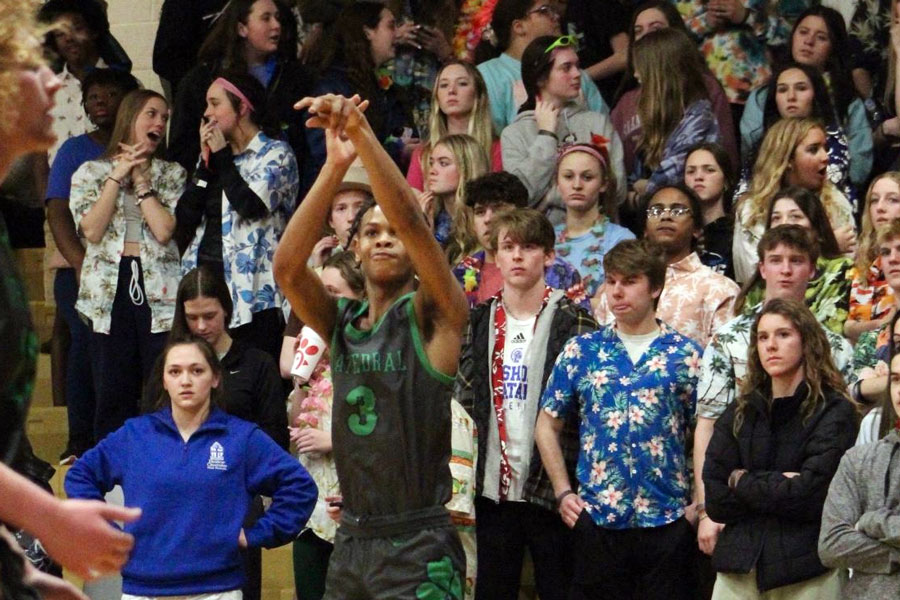 During the regular season game against Bishop Chatard, junior Sincere Germany take a two-point shot.