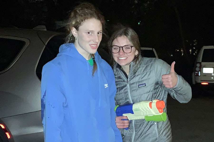 Senior Elle Lewis, right, celebrates her victory over his last opponent in the senior assassin/senior squirt competition. Grace Jarrett does not seem to share her classmate's enthusiasm. 