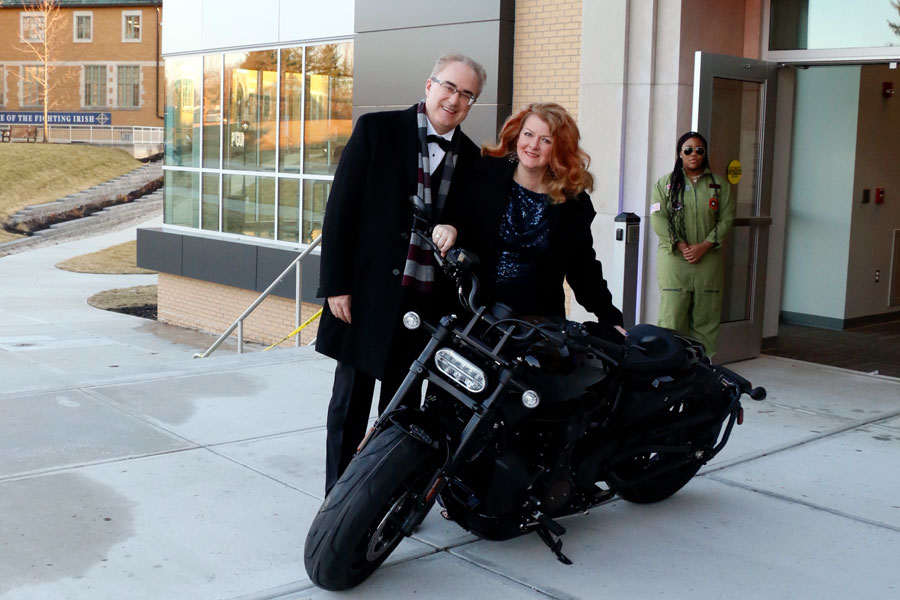 At the school's main entrance, ShamrAuction attendees got the chance to post in front of a motorcycle, part of the evening's "Top Gun" theme, on Feb. 26. 