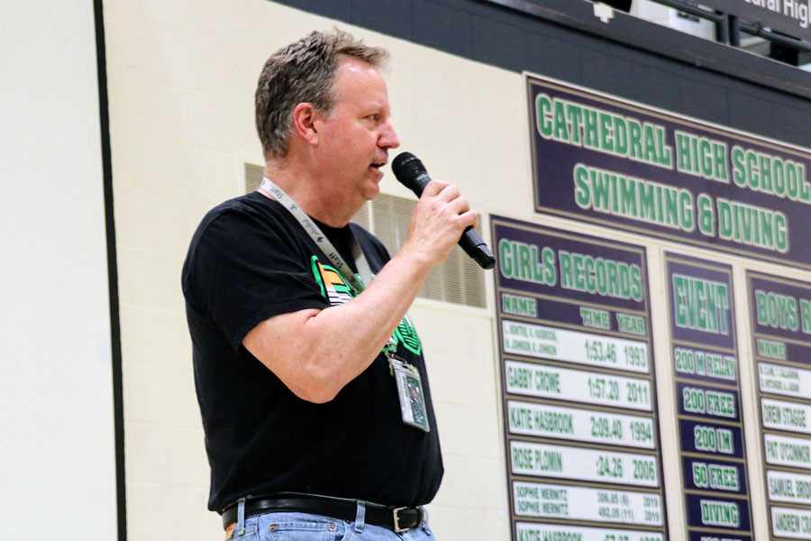 During the Irish 500 on May 20, math teacher Mr. Mike Miller provides information about the school's many traditions. 