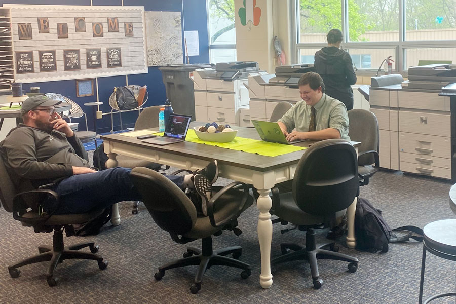 Religion teacher Mr. Matt Cannaday and Latin teacher Mr. John Streiff '09 take advantage of the newly redecorated teacher workroom in Kelly Hall. 