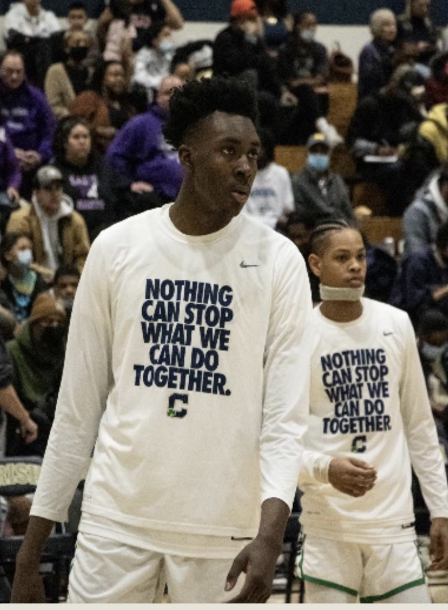 Xavier Booker warms up before a game against Ben Davis on Feb. 18, 2022. Booker would score 14 points and grab 4 rebounds in a 67-64 loss.