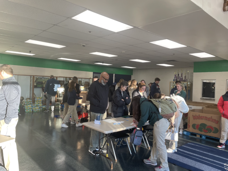 Students and staff turn in canned food in the WAC lobby on November 14. 