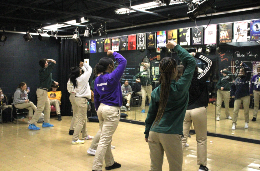 Members of the Cathedral Dance Team, led by Mrs. Jordan Fox, rehearse in the theater greenroom after school. The Dance Team performs at basketball games and school assemblies throughout the school year.