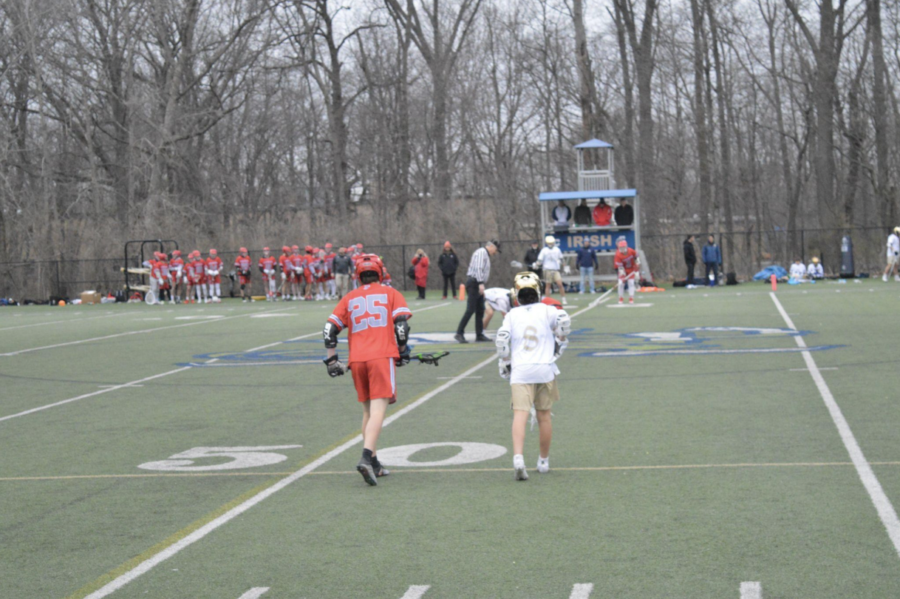 JV Lacrosse player, Colin Jackson (#8), is ready to begin the 4th quarter of the match standing
next to a Fishers HS player. Boys JV Lacrosse season began just a week ago, with a win
against Westfield High School 7 - 2 and a massive win last night against Fishers with a score of
19 - 4. “I can’t wait for the rest of the season to see how my team improves and how we grow
together and continue to succeed.” says Colin.