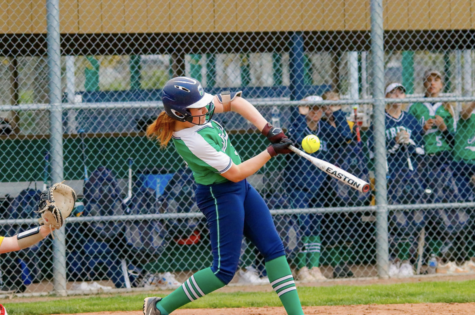 Sophomore Maddie Liter makes contact with a pitch. Liter’s home run gave the Irish the
lead in the City Championship on May 6. 