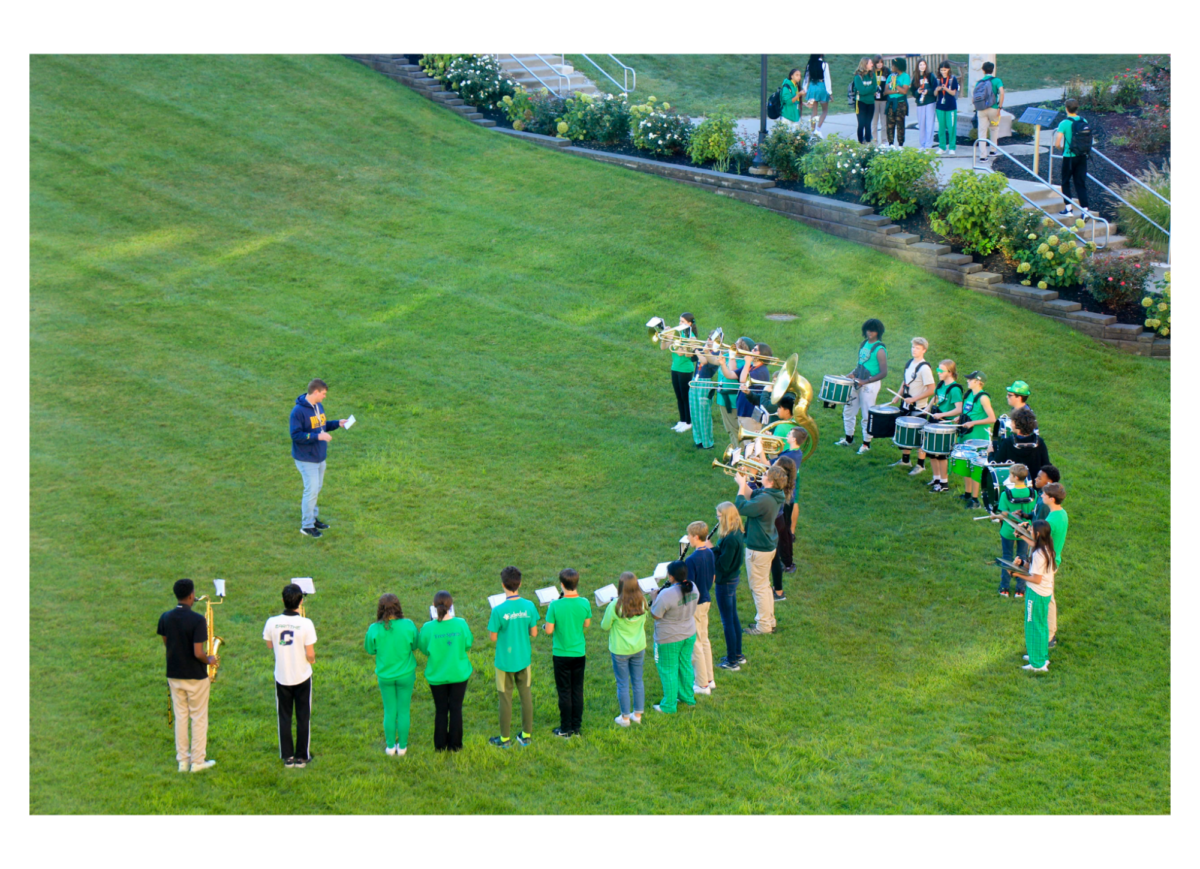 Cathedral’s band, Pride of the Irish,  outside creating a memorable morning to start off Homecoming week and All Out Irish. Cathedrals band has had some more involvement these past few days with opening up the Student Assembly last Friday and also having a new band director, Ian Callen. Lorrea Correra, a drummer for Band says, "I love the environment and support the band creates and it is just a nice school activity to be a part of.”