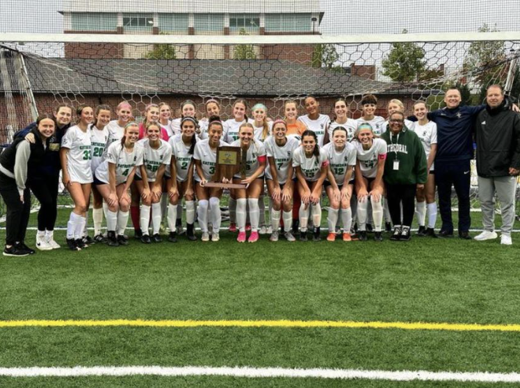 The ladies post with their trophy after defeating Carmel 2-1. Goals were scored by Kiera Bradford and Libby Lewis