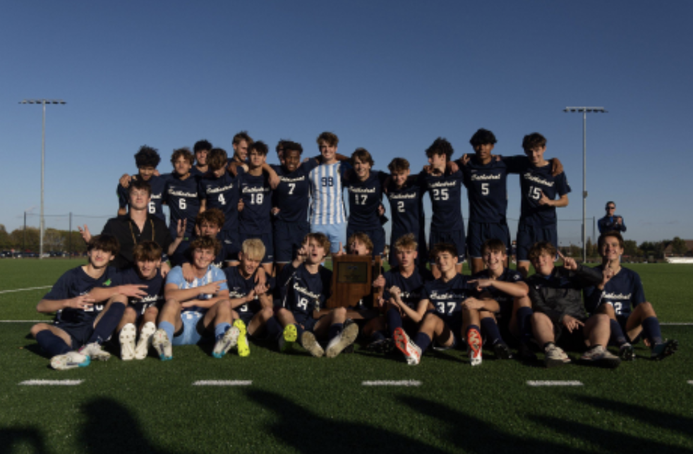 The men’s soccer team poses with the Semistate trophy after its victory over Columbus North on Oct. 21. The win clinched the team’s first ever 3A State Championship appearance. Senior and team captain Liam Fahey said, regarding the win, “Getting the win (over Columbus North) was one of if not the most satisfying win of the season.”