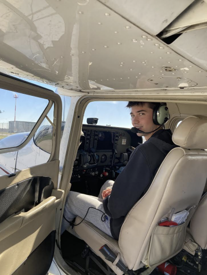 Christian sits up in the pilot's chair. His first solo flight took place last month.