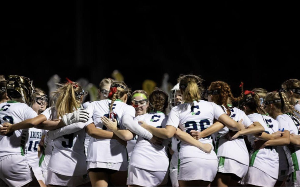 Cathedral's Girls Lacrosse team hyping each other up before a game against Guerin Catholic. The team had been mentally and physically preparing for this game, as they knew Guerin would be tough competition. Sarah Coleman said, “It was obviously going to be a hard game since they [Guerin] won state last year and was our first whole game we’ve played this season.”